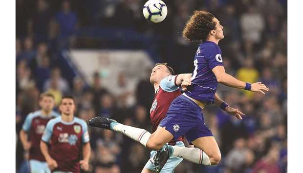 Burnleyu2019s Ashley Barnes (let) and Chelseau2019s David Luiz go for a header during the Premier League match on Monday night. (AFP)