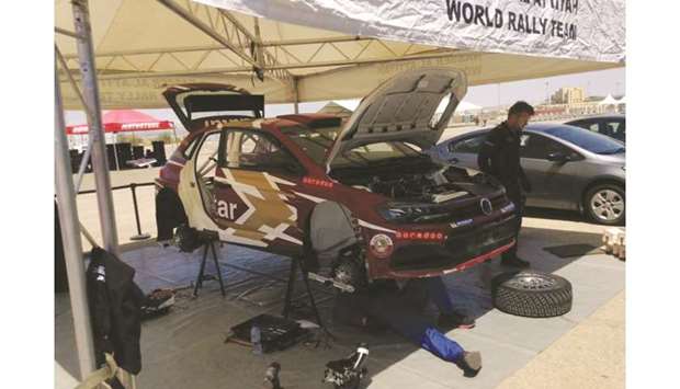 Mechanics set up Qatari star Nasser Saleh al-Attiyahu2019s car ahead of the Jordan Rally.