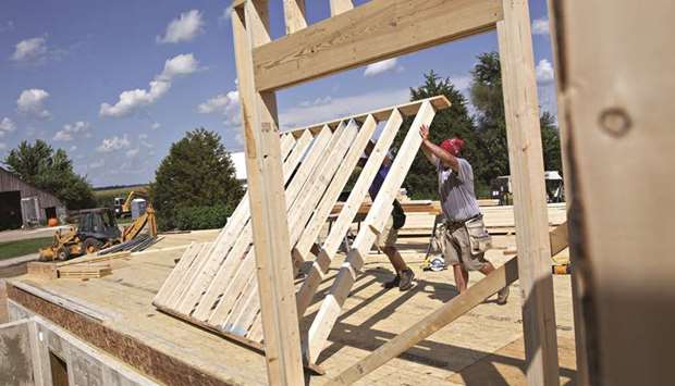 Contractors position a wall frame during construction of a home in Walnut, Illinois. A new US Housing and Urban Development guideline, published on its website late last week, would be particularly harmful to the Chenoa Fund, one of the largest down-payment programmes in the US.