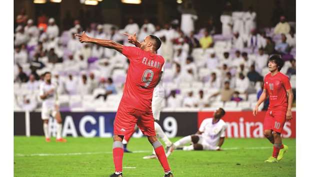Al Duhail forward Youssef El Arabi celebrates his goal during the AFC Champions League group C football match against the UAEu2019s Al Ain at the Hazza Bin Zayed Stadium in Al Ain yesterday.