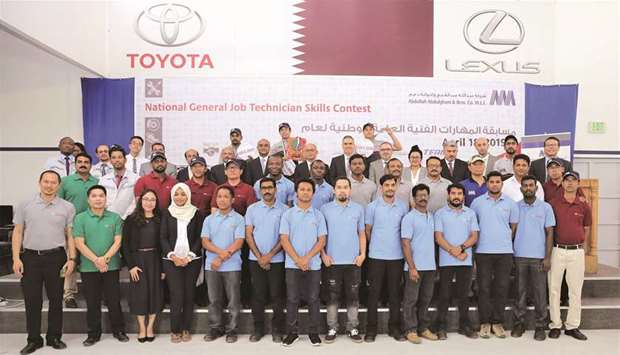 Officials with participants in the contest.