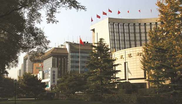 The Peopleu2019s Bank of China headquarters (right) in Beijing. The PBoC is likely to pause to assess economic conditions before making any further moves to ease lendersu2019 reserve requirements, after better-than-expected growth data reduced the urgency for action, policy insiders said.