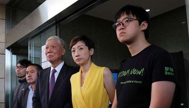 Pro-democracy activists Chung Yiu-wa, Lee Wing-tat, Chu Yiu-ming, Tanya Chan and Cheung Sau-yin leave the court after getting their suspended sentence on their involvement in the Occupy Central, also known as ,Umbrella Movement,, in Hong Kong