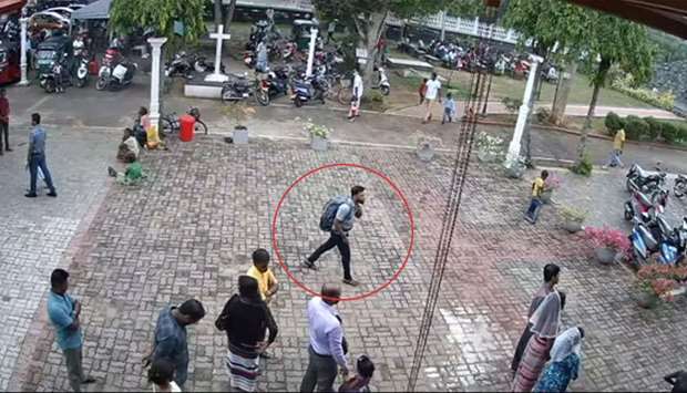 CCTV footage shows the suspected bomber (C) with backpack on his way to enter St. Sebastian's Church in Negombo