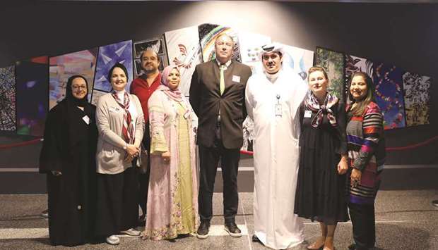 Some of the artists with HIAu2019s Abdulaziz al-Mass and Austrian ambassador Willy Kempel in front of u2018Wingsu2019.