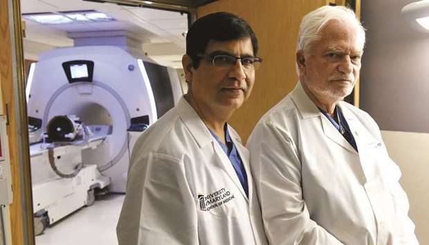 NEW HOPE: Doctors Dheeraj Gandhi, left, Chief of Interventional Neuroradiology, and Howard Eisenberg, Neurosurgery, University of Maryland Medical Center, are using targeted ultrasound to treat neuropathic pain in a clinical trial.