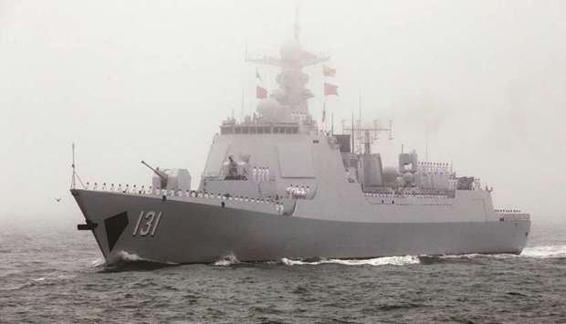 Chinese Navyu2019s guided missile destroyer Taiyuan takes part in a naval parade off the eastern port city of Qingdao, to mark the 70th anniversary of the founding of Chinese Peopleu2019s Liberation Army Navy, China.