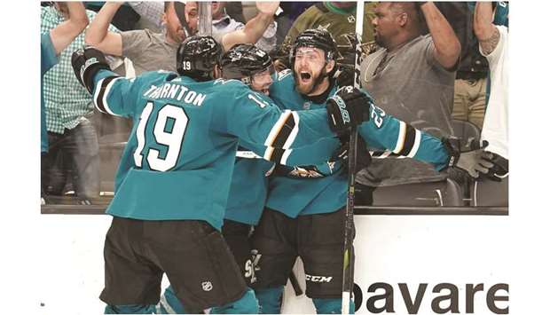 San Jose Sharksu2019 Barclay Goodrow (right) celebrates with teammates Marc-Edouard Vlasic (centre) and Joe Thornton after defeating the Vegas Golden Knights during overtime in game seven of the first round of the 2019 Stanley Cup Playoffs in San Jose, United States, on Tuesday. (USA TODAY Sports)