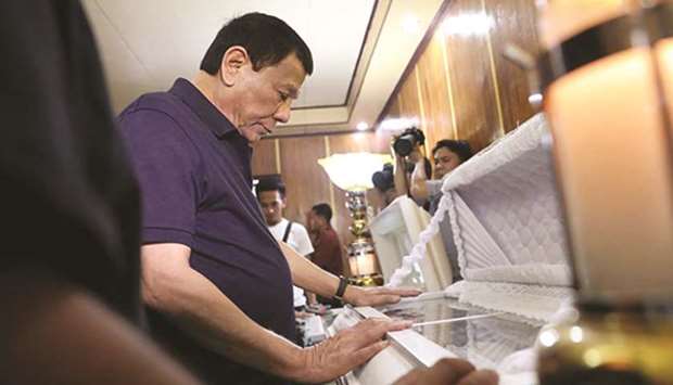 President Rodrigo Duterte attends the funeral of a victim of the Pampanga earthquake on Tuesday.