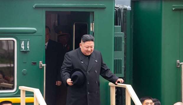 This handout picture provided by press service of Administration of Primorsky Krai shows North Korean leader Kim Jong Un disembarking from his private armoured train at a station in the Russian border town of Khasan
