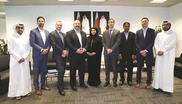 Officials from Communications Regulatory Authority and members of the GSMA delegation at the authorityu2019s headquarters in Doha.