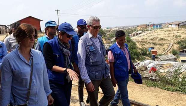 United Nations High Commissioner for Refugees (UNCHR) Filippo Grandi (2R) walks with other members of the delegation of United Nations organizations during their visit to a Rohingya camp in Ukhia, near Cox's Bazar in Bangladesh