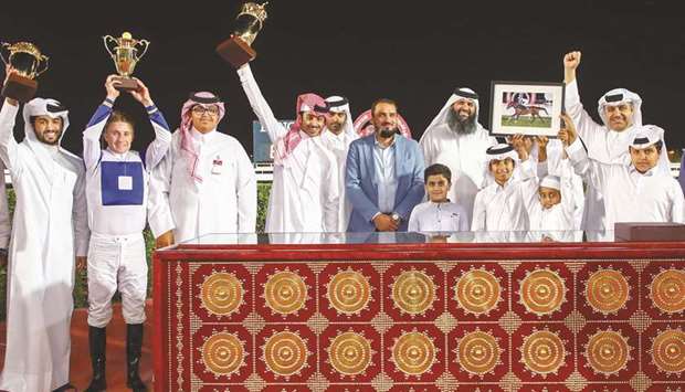 The connections of The Blue Eye celebrate after winning the Al Karana Cup, the feature event of the final day of the racing season at the Al Rayyan Park on Thursday.