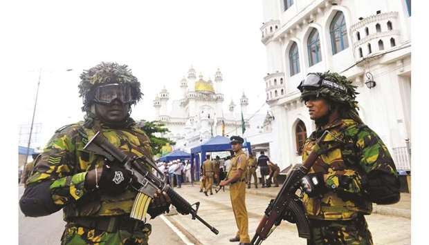 Soldiers stands guard in Colombo yesterday following a series of bomb blasts targeting churches and luxury hotels on Easter Sunday in Sri Lanka.