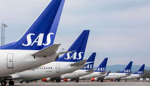 SAS airplanes are seen parked on the tarmac as SAS pilots go on strike at Oslo Airport in Gardermoen, Norway
