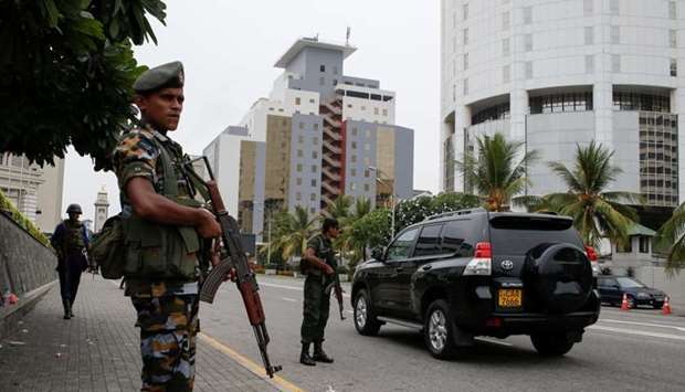 A security officers patrol outside a luxury hotel, days after a string of suicide bomb attacks across the island on Easter Sunday, in Colombo