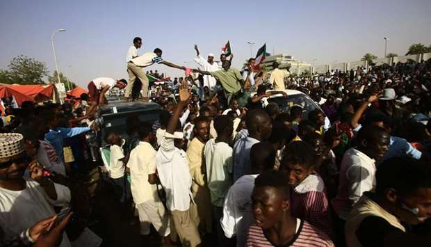 Sudanese protesters gather near the military headquarters in the capital Khartoum, during a rally