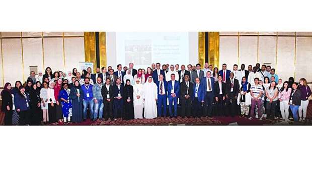 Participants pose for a photo at the fifth annual symposium for Community Mental Health Services in Qatar.