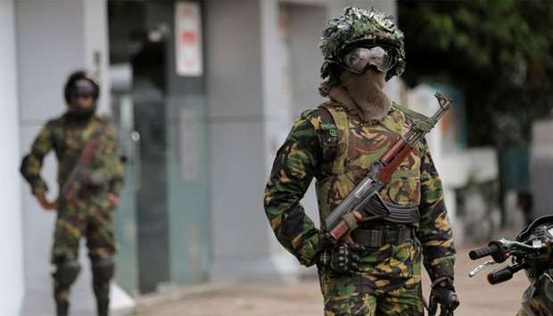 Sri Lankan Special Task Force soldiers stand guard