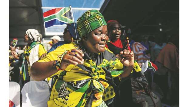 A South African woman dances at the Miki Yili Stadium in Makhanda, Eastern Cape Province.