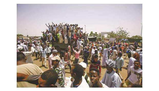 Sudanese protesters gather near the military headquarters in the capital Khartoum, during a rally, yesterday.