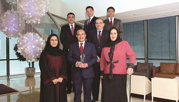 Abraham (front row, middle), Sah and other senior executives with the u2018Asian Banker Financial Technology Innovation Award 2019.u2019