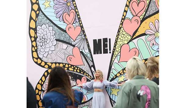 WATCH OUT! In advance of her new song release, Taylor Swift surprises fans at the new Kelsey Montague u2018What Lifts You Upu2019 Mural last Thursday in Nashville, Tennessee. Swift commissioned the mural and put clues about her upcoming new music in the piece.