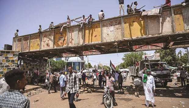 Sudanese protesters gather during a sit-in outside the army headquarters in Khartoum, yesterday.