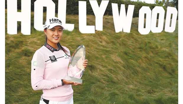 Minjee Lee of Australia poses for photos with the winneru2019s trophy after winning the LA Open at Wilshire Country Club in Los Angeles, California. (Getty Images/AFP)