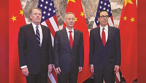 Chinau2019s Vice Premier Liu He (centre) pose for a photo with US Treasury Secretary Steven Mnuchin (right) and US Trade Representative Robert Lighthizer at Diaoyutai State Guesthouse in Beijing (file). US negotiators are visiting China today to try to hammer out details to end the two countriesu2019 trade war, including the shape of an enforcement mechanism, the success or failure of which could set the trajectory of ties for years to come.