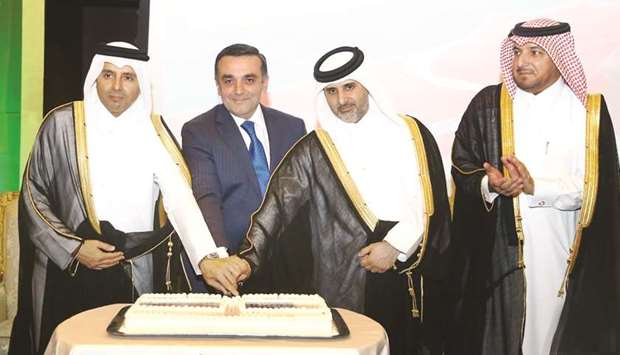 HE the Minister of Education and Higher Education Dr Mohamed Abdul Wahed Ali al-Hammadi and HE the Minister of Municipality and Environment Abdullah bin Abdulaziz bin Turki al-Subaie cutting the ceremonial cake with Azerbaijanu2019s ambassador Rashad Ismayilov as the director of Protocol at the Ministry of Foreign Affairs, ambassador Ibrahim Yousef Fakhro, looks on. PICTURES: Jayan Orma