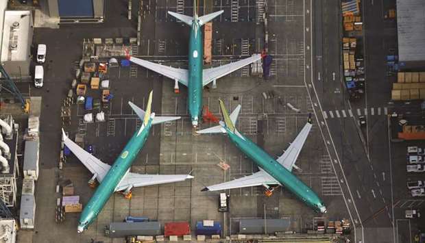 An aerial photo shows Boeing 737 MAX airplanes parked on the tarmac at the Boeing Factory in Renton, Washington, on March 21, 2019.