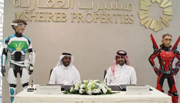 Ali al-Kuwari and Ali bin Mohamed al-Attia at the signing ceremony to set up Juniverse at Msheireb Downtown Doha.