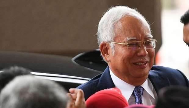 Malaysia's former prime minister Najib Razak arrives at a court for his trial over 1MDB corruption allegations in Kuala Lumpur