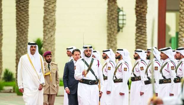 Italian Prime Minister Giuseppe Conte, accompanied by His Highness the Amir Sheikh Tamim bin Hamad al-Thani, reviewing a guard of honour at the Amiri Diwan.
