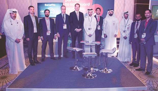 Dignitaries from Ooredoo during a group photo.