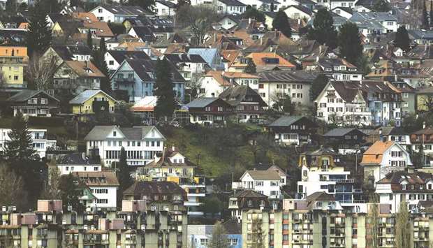 Residential apartment blocks and traditional Swiss residential properties stand in Zurich. Recent stress tests showed Switzerlandu2019s property market should be the focus of supervision, the banking regulator Finma said, and called the mortgage market u201ctoo big to fail.u201d