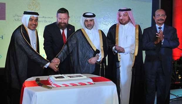 CEREMONY: Officials and guests during the cake-cutting ceremony on the 728th Swiss National Day.  Photos by Nasser T K