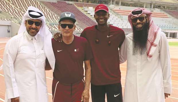 Qataru2019s star high-jumper Mutaz Barshim (second from right) and his coach Stanislaw Szczyrba (second from left) were joined in a training session by Qatar Athletics Federation president and Qatar Olympic Committee second vice-president Dr Thani Abdulrahman al-Kuwari (left) and deputy manager of national teams Khalid al-Marri yesterday. (Twitter/mutazbarshim)