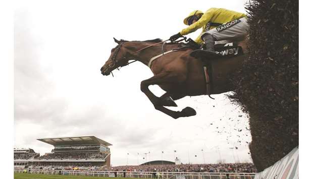 Action from the second day of the Grand National Festival at Aintree Racecourse in Liverpool yesterday. (Reuters)