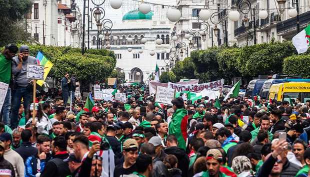 Algerians march during an anti-government demonstration in the capital Algiers, yesterday.
