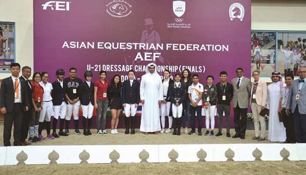 Hamad bin Abdul Rahman al-Attiyah, Qatar and Asian Equestrian Federation President, poses with the participants and officials of the Asian Equestrian Federation (AEF) U-21 Dressage Championship yesterday.