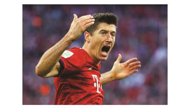 Bayern Munichu2019s Robert Lewandowski celebrates after scoring against Dortmund yesterday. (Reuters)