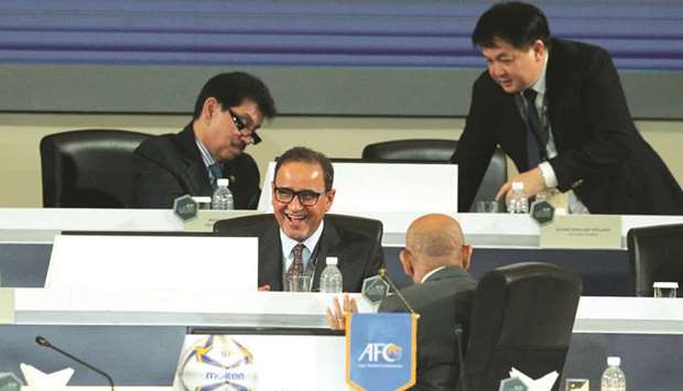 Qataru2019s Saoud al-Mohannadi (centre) at the 29th AFC Congress in Kuala Lumpur, Malaysia, yesterday.