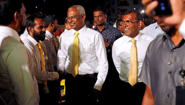 Maldives President Ibrahim Mohamed Solih and former president Mohamed Nasheed arrive at an election campaign rally ahead of their parliamentary election, in Male, Maldives on April 4
