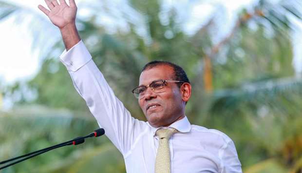 In this file photo taken on November 1, 2018 former president of the Maldives Mohamed Nasheed waves as he addresses the country after returning from exile to the Maldives, in Male.