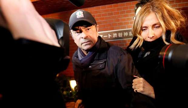 Former Nissan Motor Chairman Carlos Ghosn accompanied by his wife Carole Ghosn, arrives at his place of residence in Tokyo, Japan on March 8, 2019
