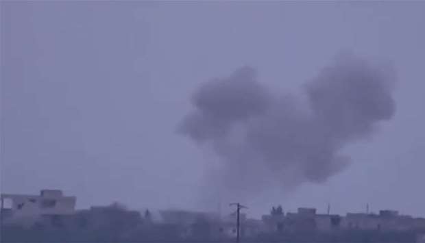 Smoke rises after shelling by government forces in Hama