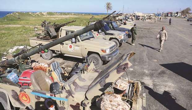 Military vehicles of Misrata forces, under the protection of Tripoliu2019s forces, are seen in Tajura neighbourhood, east of Tripoli, yesterday.
