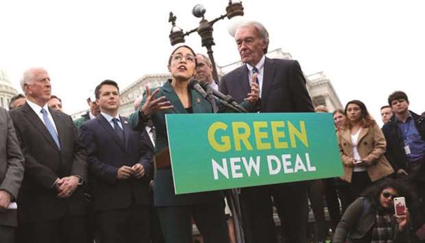 US Representative Alexandria Ocasio-Cortez (D-NY) and Senator Ed Markey (D-MA) hold a news conference for their proposed u201cGreen New Dealu201d to achieve net-zero greenhouse gas emissions in 10 years, at the US Capitol in Washington, in this February 7, 2019 file picture.  The u201cGreen New Dealu201d presents monetary finance as one option for financing socially and environmentally desirable investment.